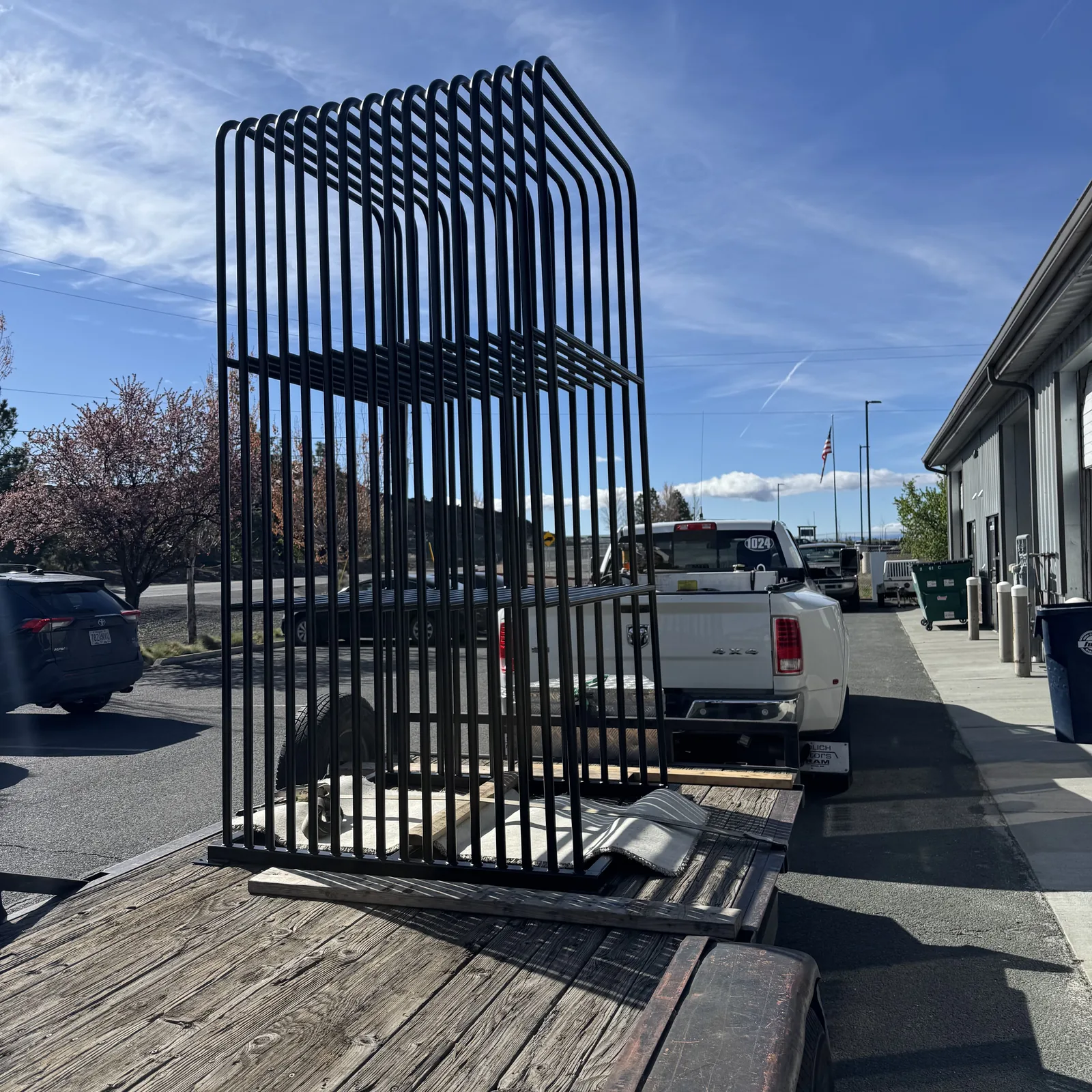 Production racks loaded with parts at Advanced Coatings