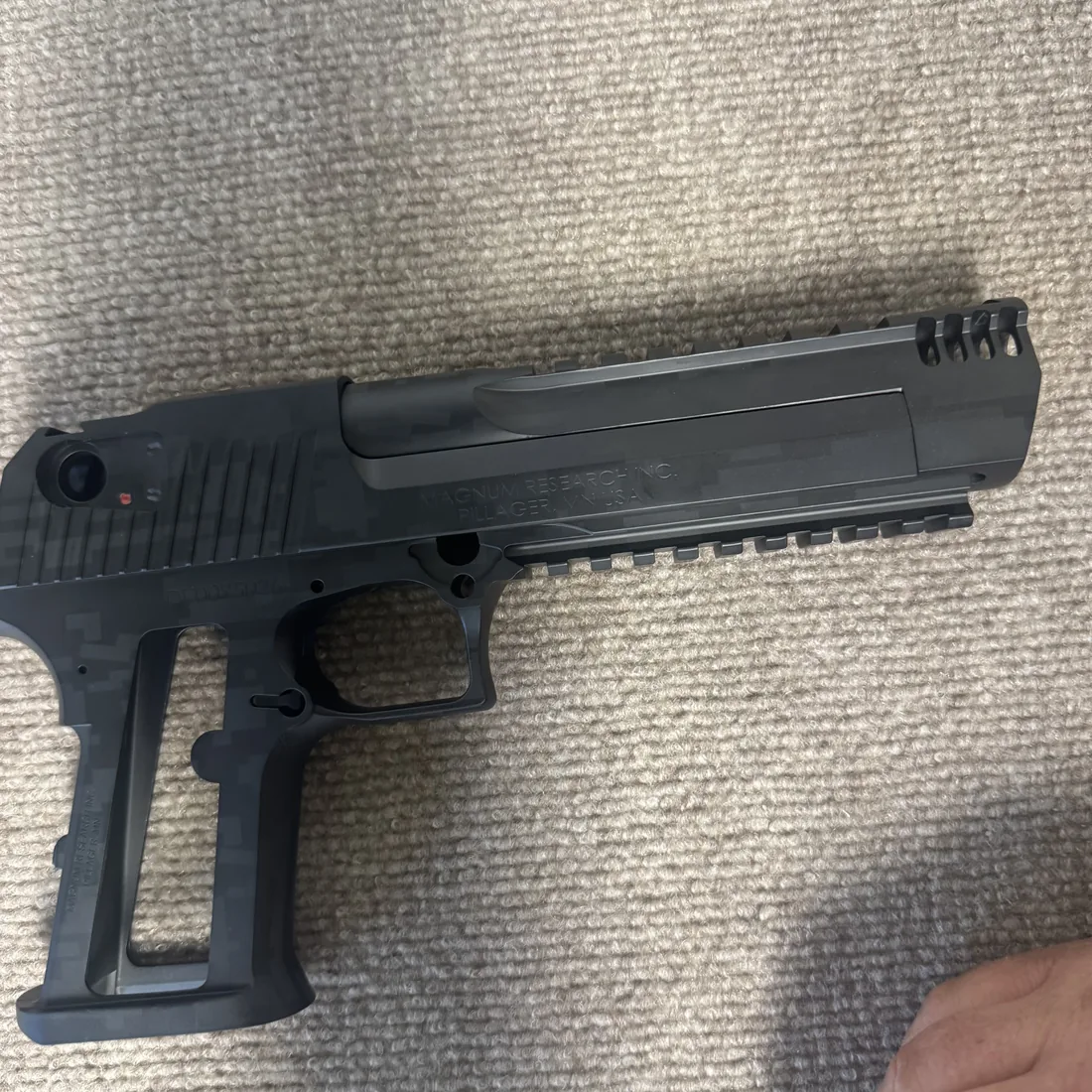 After: black Cerakote pistol finish