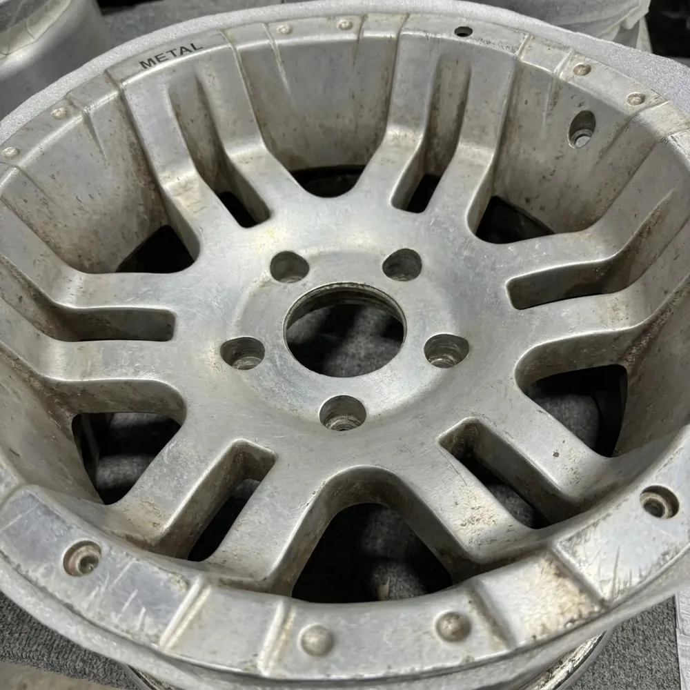 Before: bare oxidized aluminum wheel